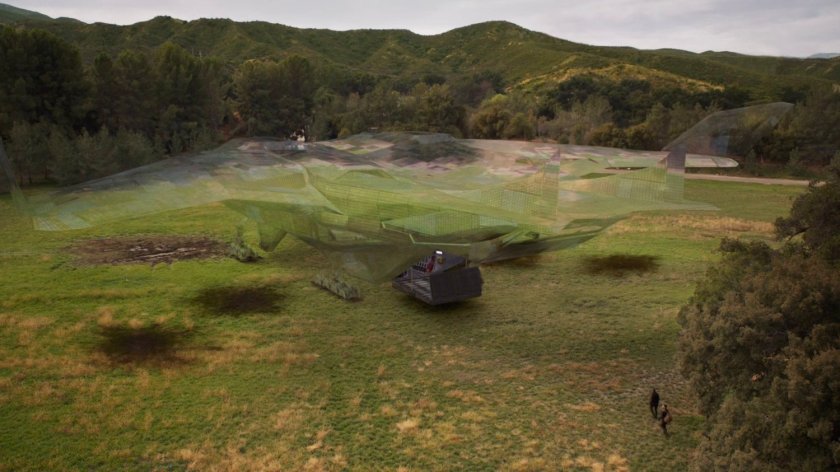 A cloaked Zephyr One in a field outside River's End.