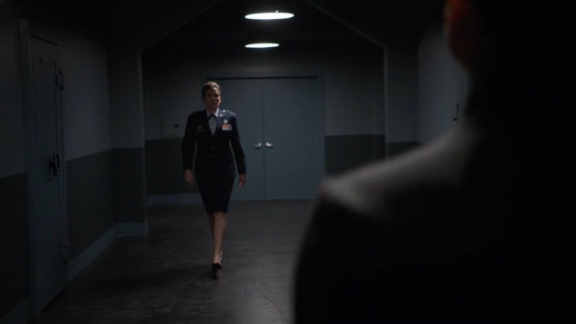 General Hale and her aide in a non-descript hallway.