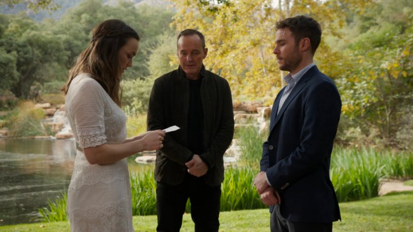 Simmons, Coulson, and Fitz in front of a waterfall and lake on Level 27 of The Lighthouse.