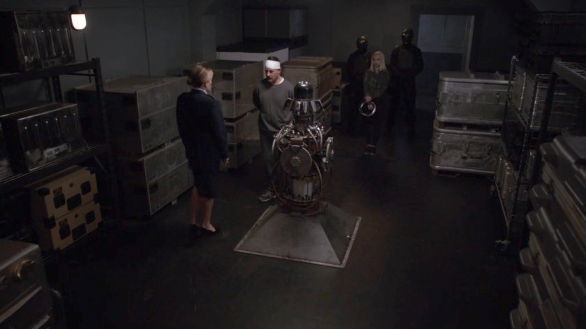 General Hale and Talbot in a storage room at her Base.