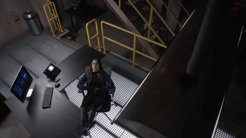Daisy in a chair at the command center in The Lighthouse.