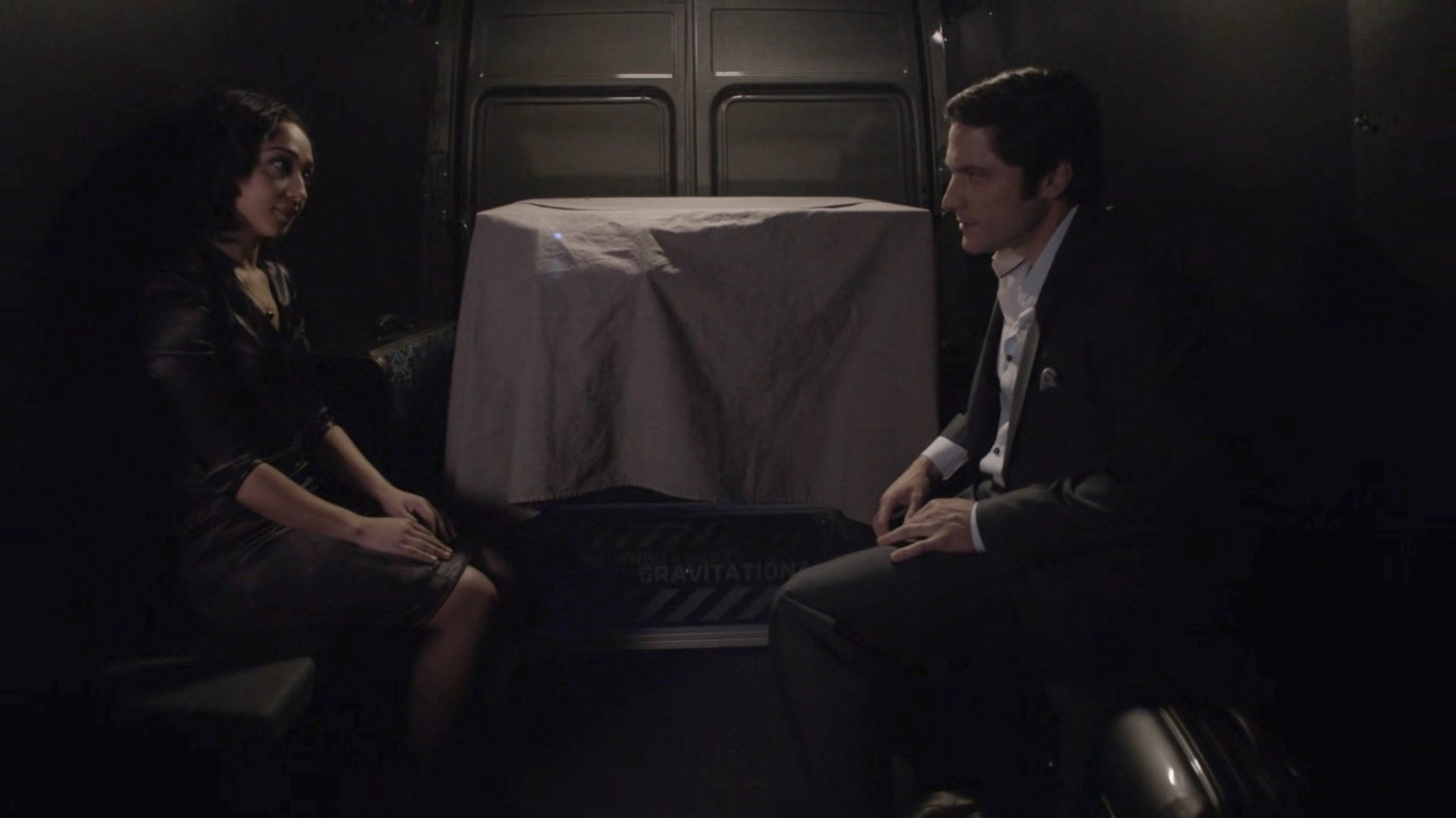 Raina and Ian Quinn in a dark van.