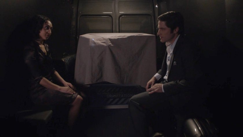 Raina and Ian in a dark van.