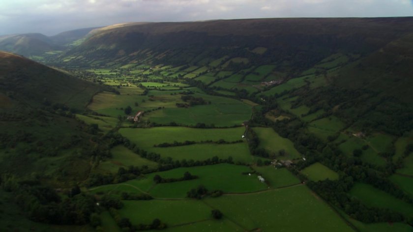 Aerial of lush, green Herefordshire valley.