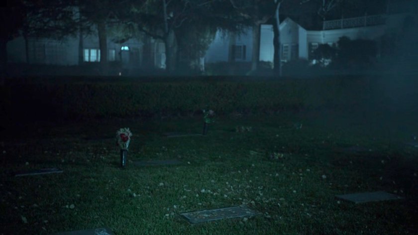 Foggy cemetery at nighttime.