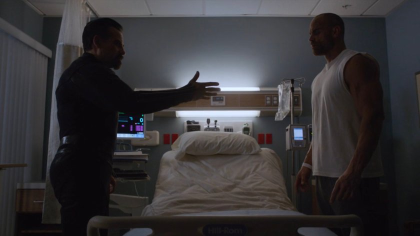 Talbot and Carl Creel in a hospital room.