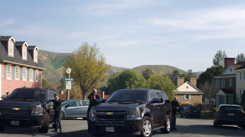 SHIELD agents with guns drawn outside the Talbot house.