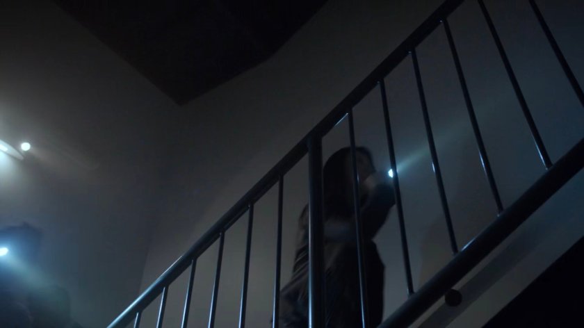 May runs up stairs in a Chicago high rise.