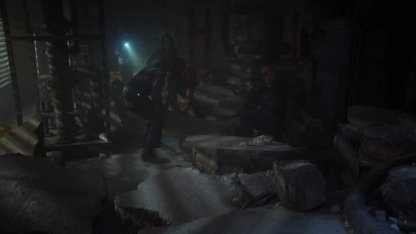 Fitz, Mack, and May in a debris strewn room of a Chicago high rise.