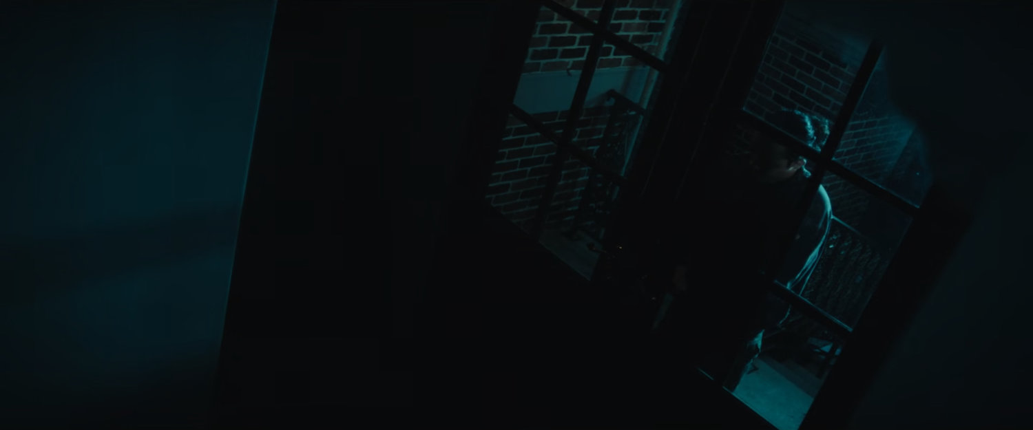 The Hood breaking into a fancy mansion at night.