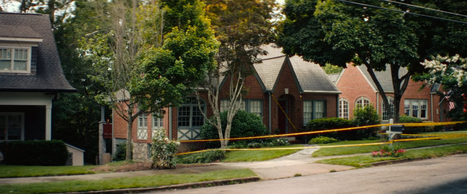 Yellow caution tape around Joe's house.
