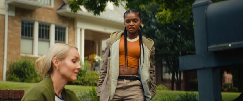 Riri on the sidewalk across from Joe's house with Heather.