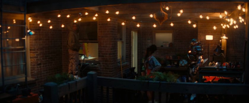 NATALIE and the Ironheart suit on Riri's apartment balcony.