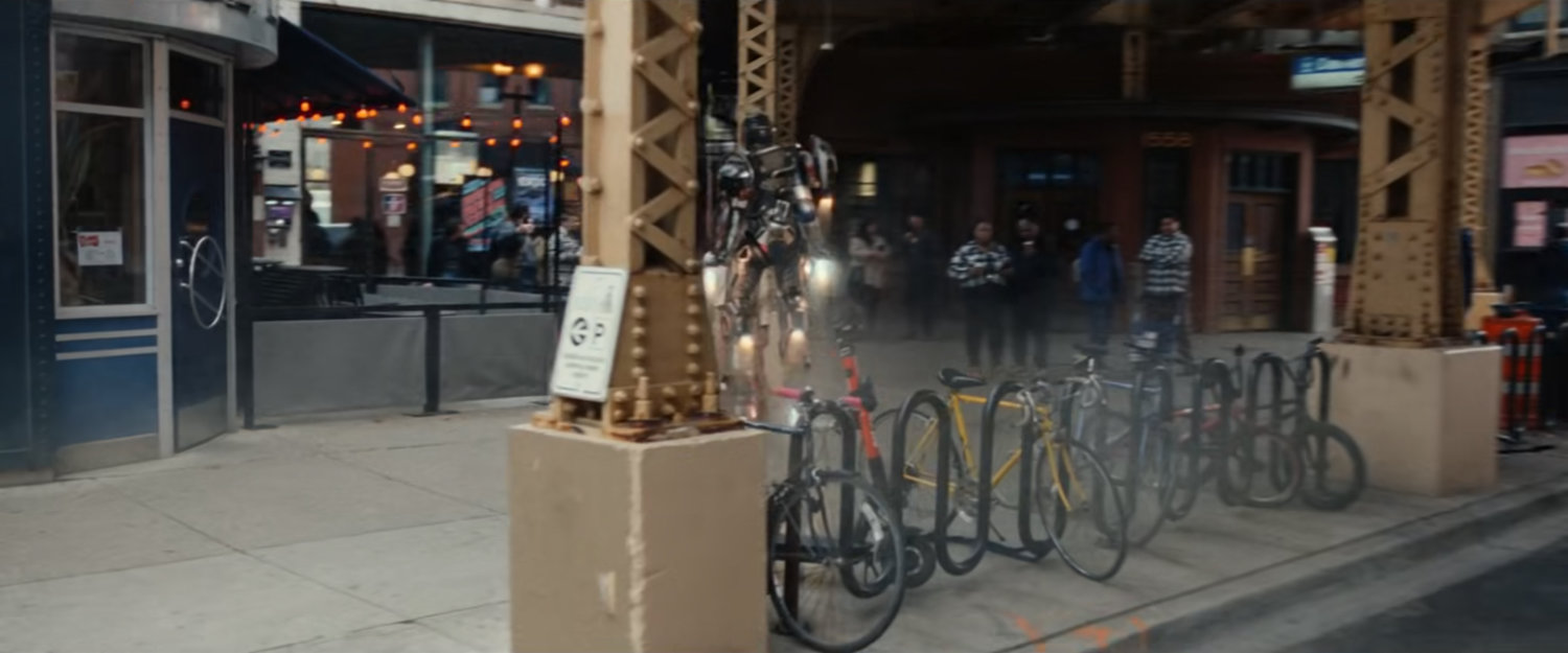 Ironheart lifts off under an L Train.