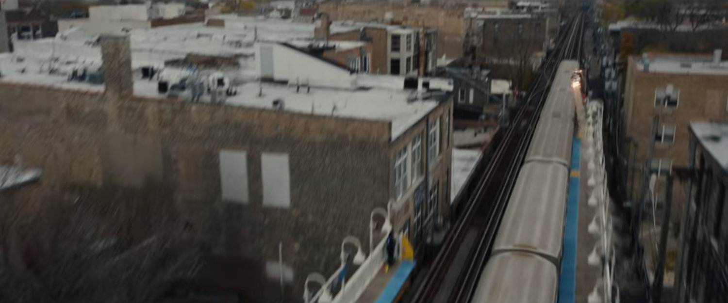 Ironheart streaks away from an L Train.