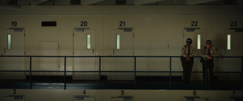 Two guards on a balcony at the Cook County Jail.