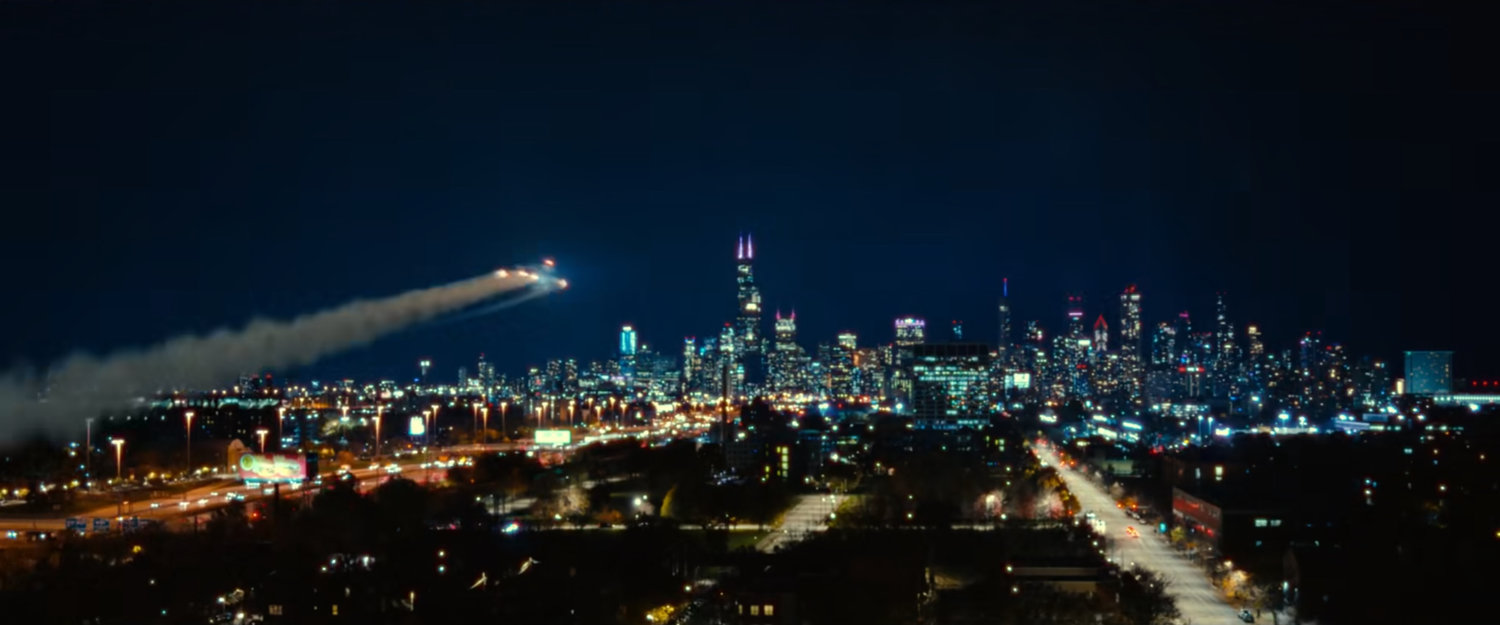 Ironheart flying towards Chicago at night.