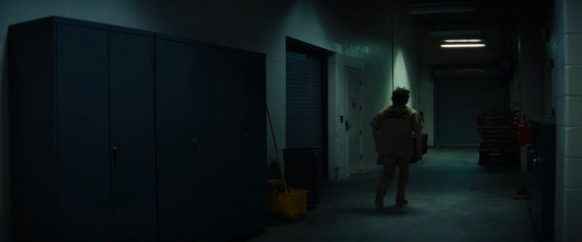 Joe walking through a dark hallway at Cook County Jail.