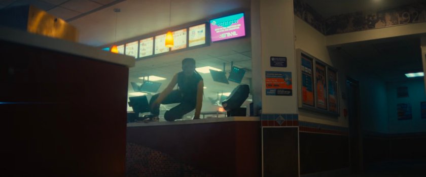 Riri leaping over a counter inside White Castle.
