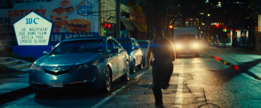 Riri running along street followed by Van outside White Castle.