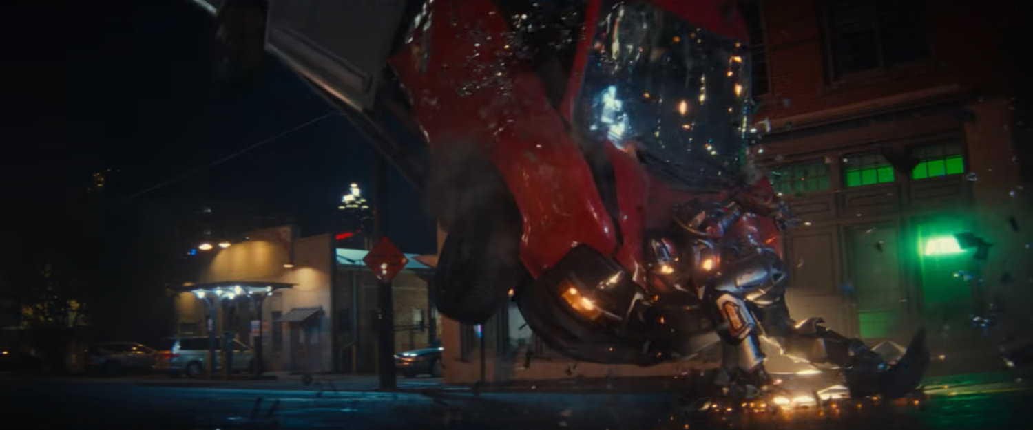 Ironheart punches a van, sending it flying, outside White Castle.