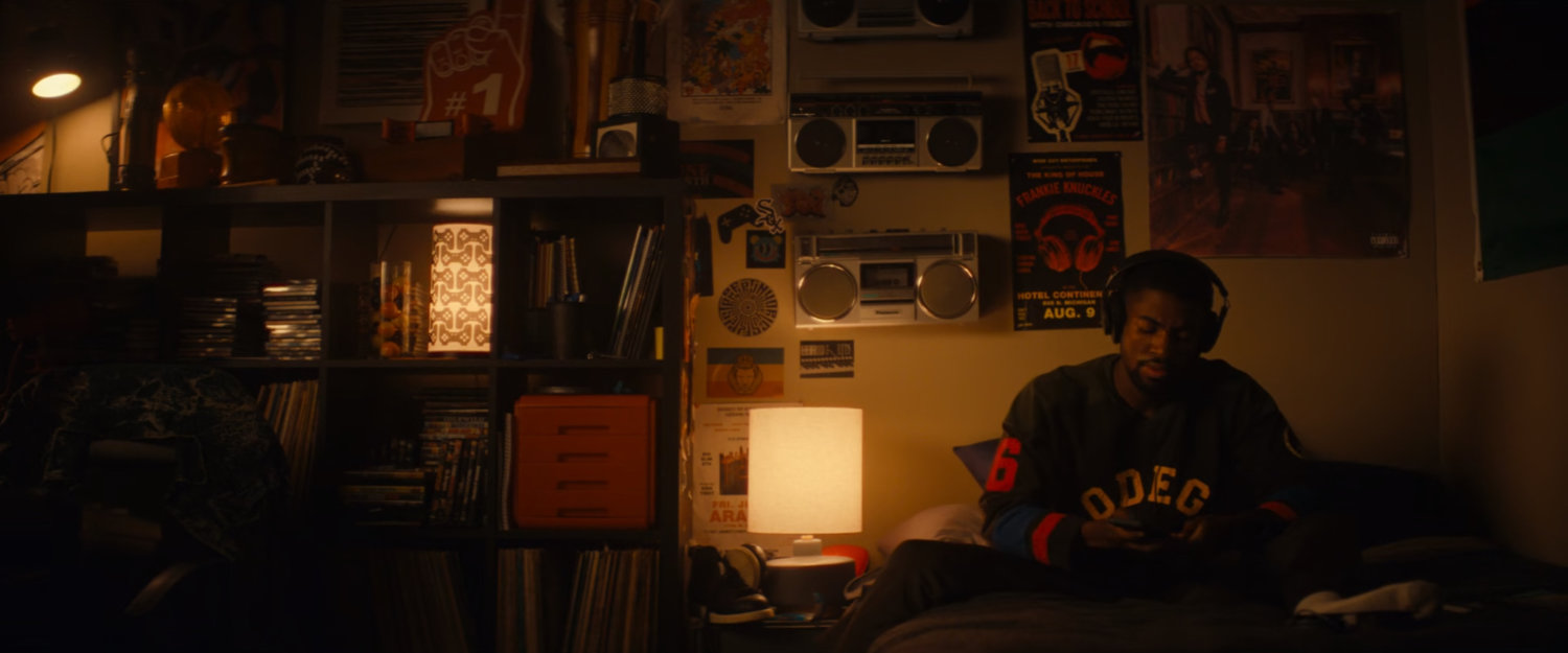 Xavier listening to music in his apartment.