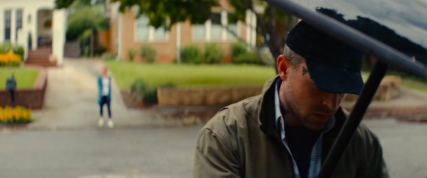 Heather taunting Joe outside his house.