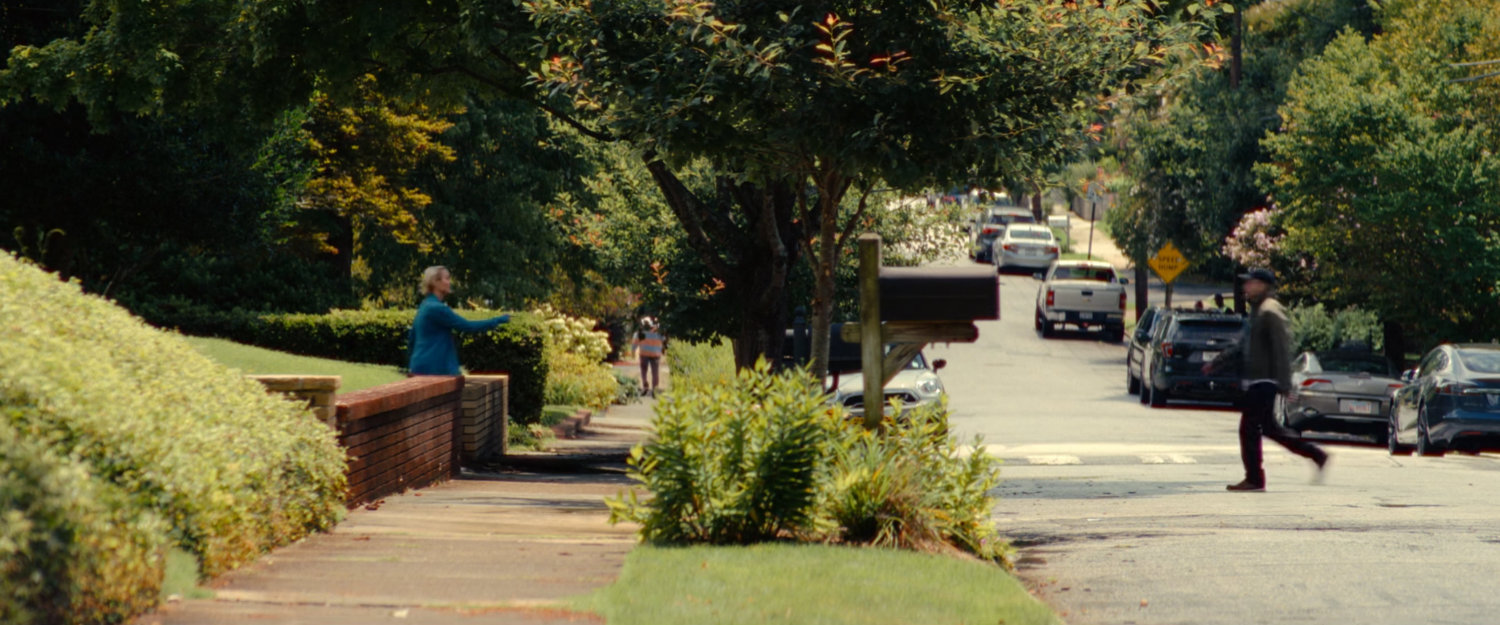 Joe crossing the street to Heather's house.