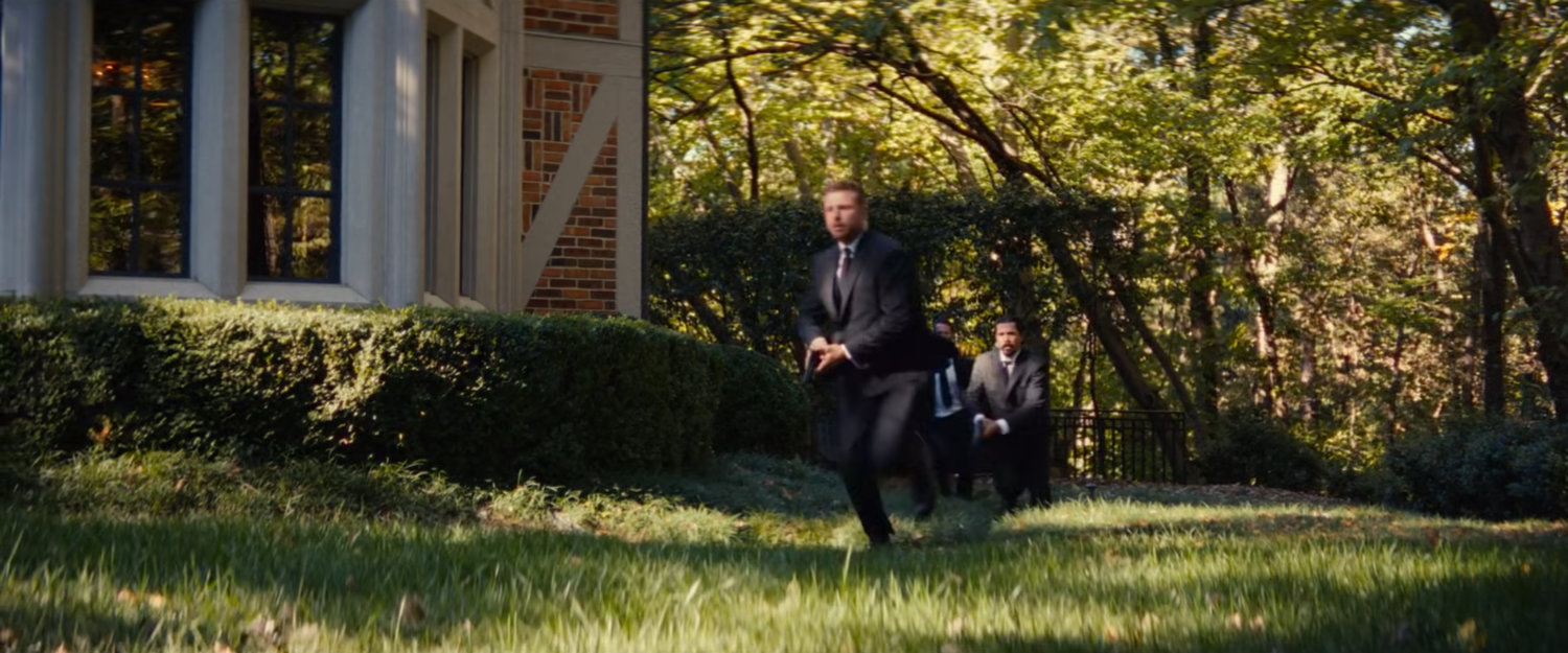 Guards run around a mansion.