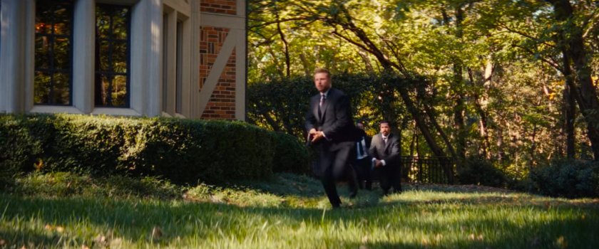 Guards run around a mansion.