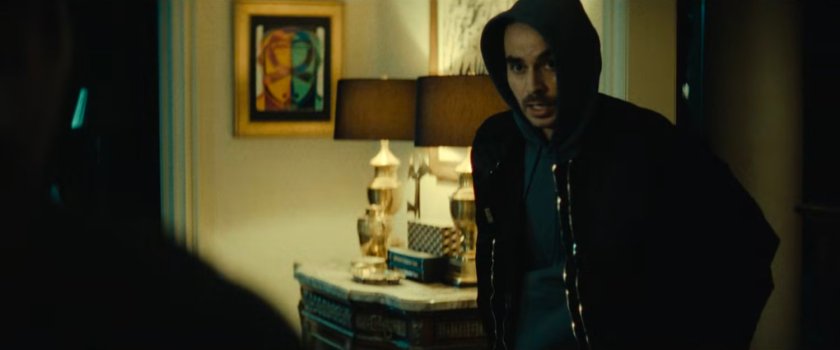 Flashback of John in a fancy mansion.