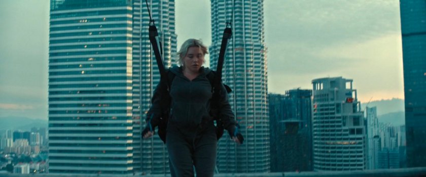 Yelena parachuting onto a building in Kuala Lumpur.