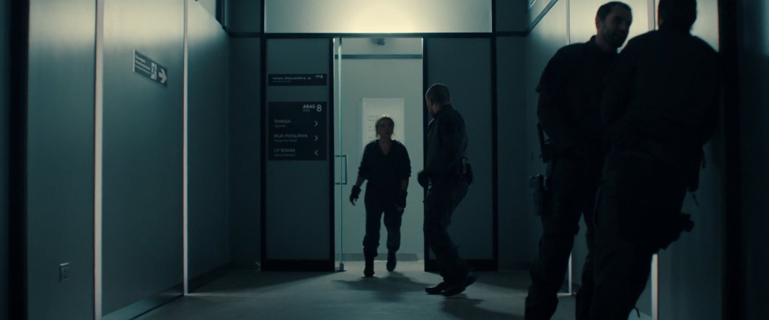 Yelena entering a hallway in a Kuala Lumpur OXE Lab.