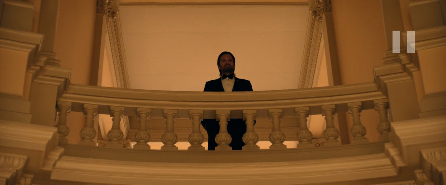 Bucky looking over a balcony at the Honoring the Heroes party.
