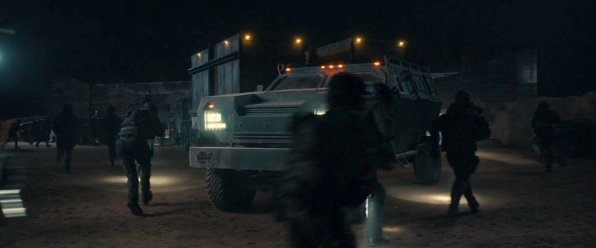 Soldiers stopping a truck in the OXE Vault courtyard.