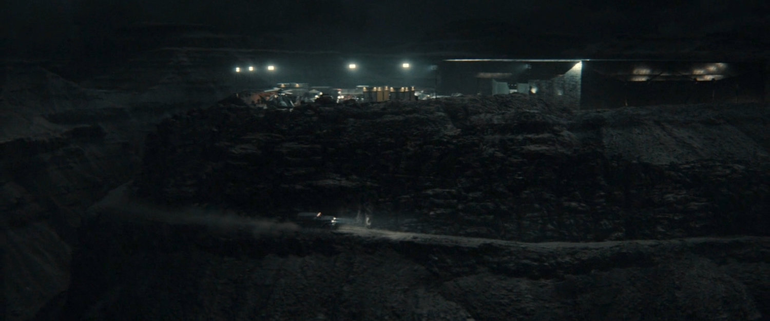 Nighttime view of OXE Vault courtyard and hill.