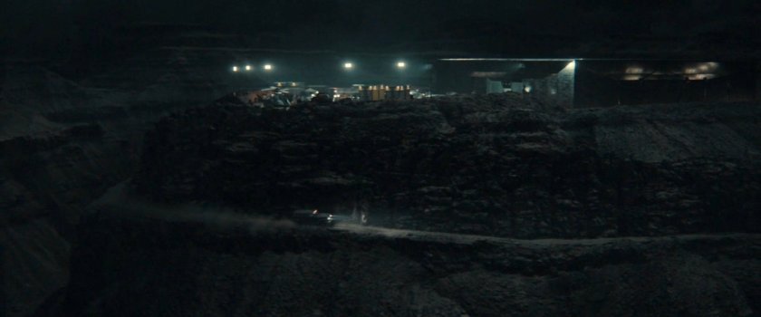 Nighttime view of OXE Vault courtyard and hill.