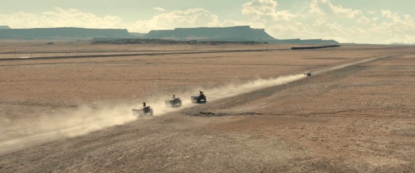 Three APCs chasing a limo across the desert of Utah.