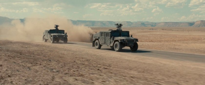 Two APCs driving across the desert of Utah.