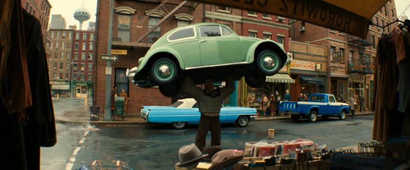 Ben lifting a car above his head on Yancy Street.