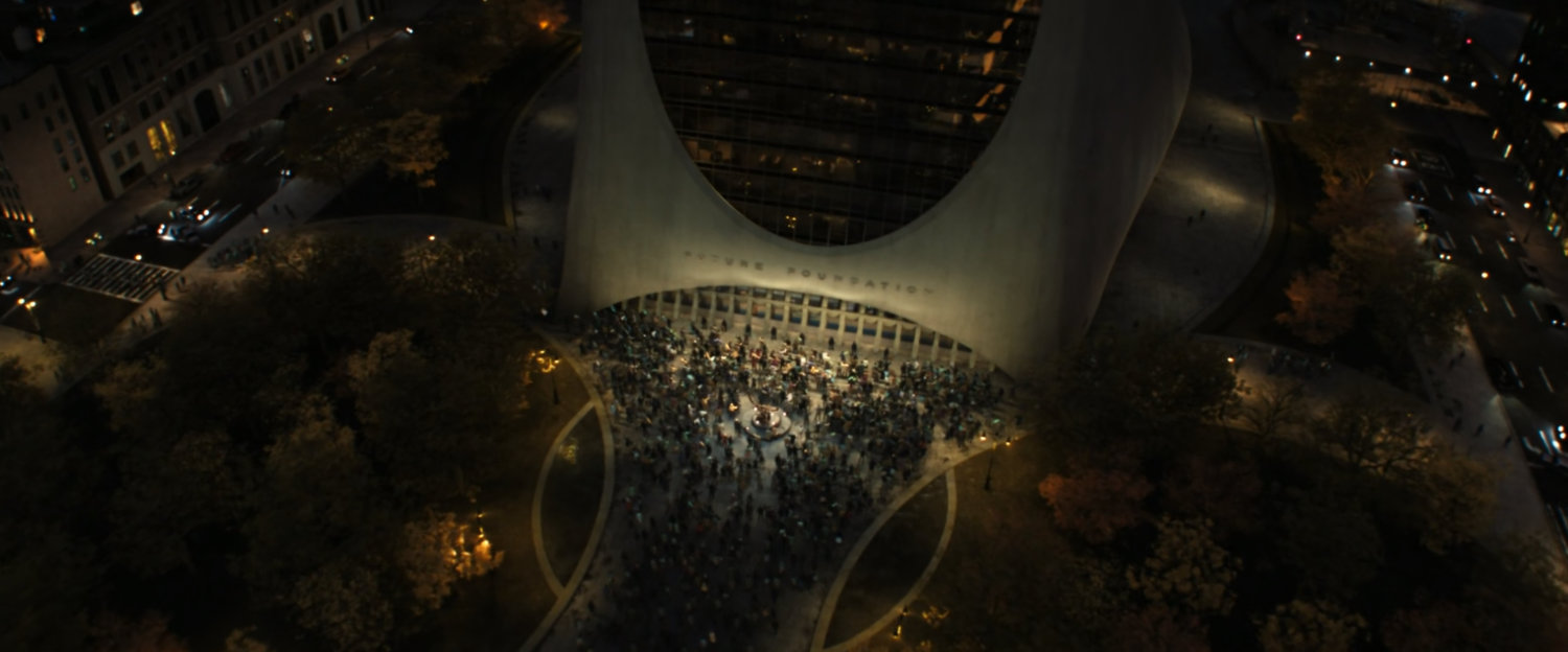 Aerial view of people crowding the front courtyard of the Future Foundation.