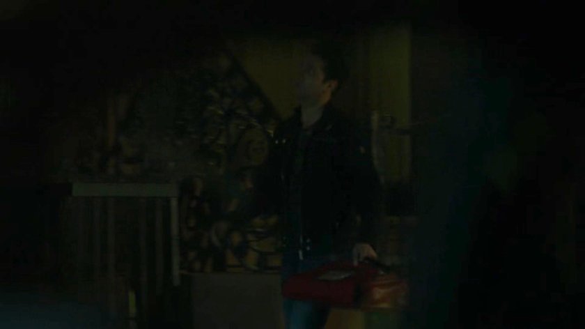 Rafi walking along a sidewalk at night.