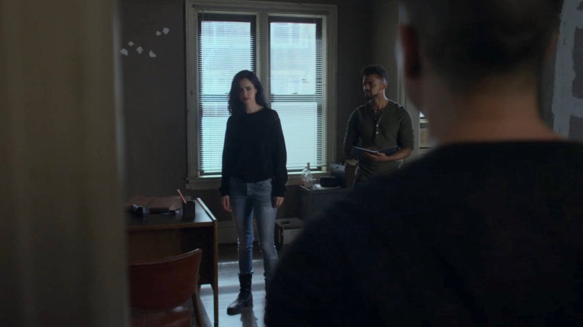 Jessica and Malcolm talk to Pryce in the Alias Investigations office.