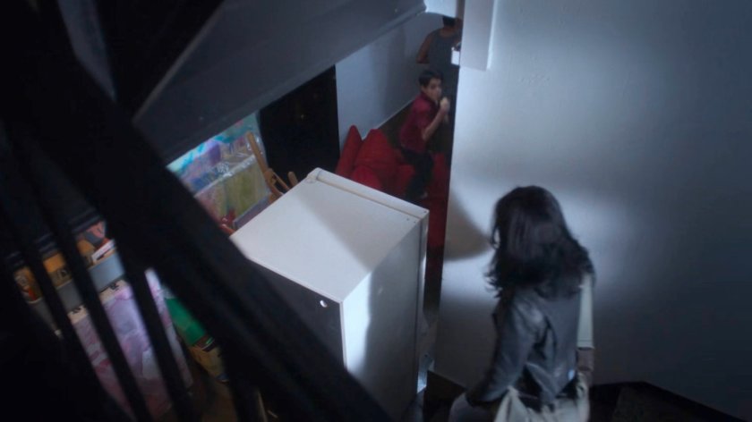 Jessica blocked by the Arodo's furniture by the stairway.