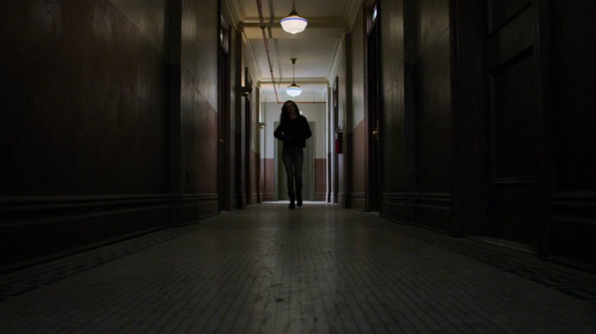 Jessica in the hallway outside the Alias Investigations office.