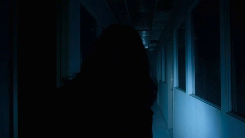 Jessica inside of the Industrial Garments & Handling building.