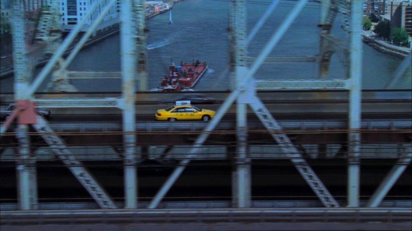Cab driving across the Queensboro Bridge.