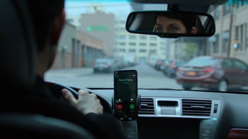 Jeri sitting in her car at a stoplight.