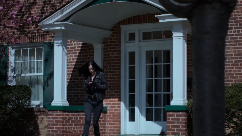 Jessica exiting Dr. Kozlov's house.