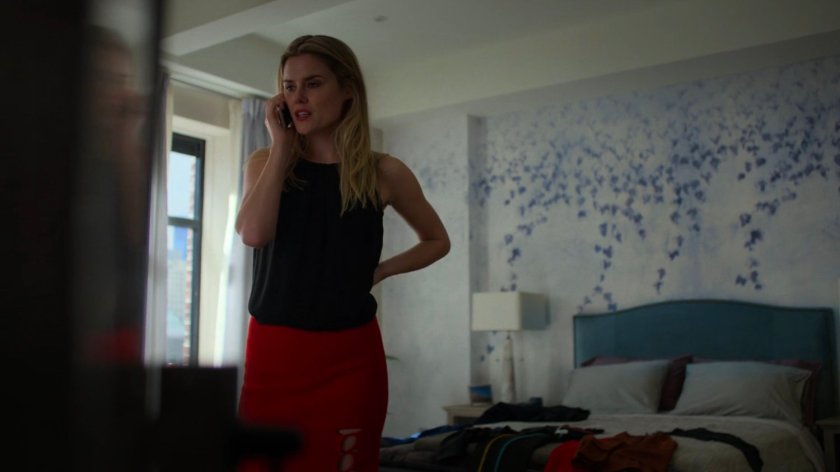 Trish on the telephone in her bedroom.